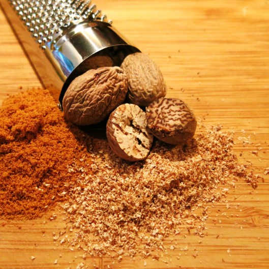 Whole Nutmeg and a Nutmeg Grater