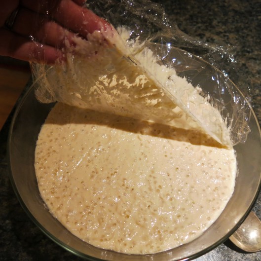 Removing the Plastic Wrap from the Chilled Tapioca Pudding