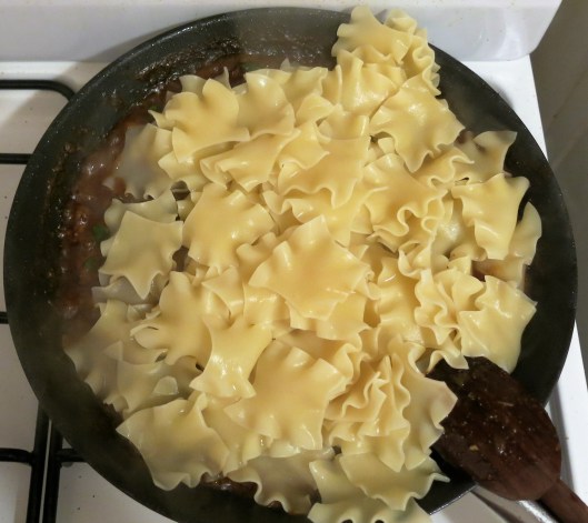 Undercooked Pasta added to Bubbling Hot Sauce