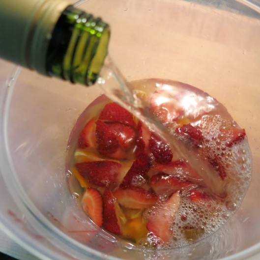 White wine being added to the Summer Sangria