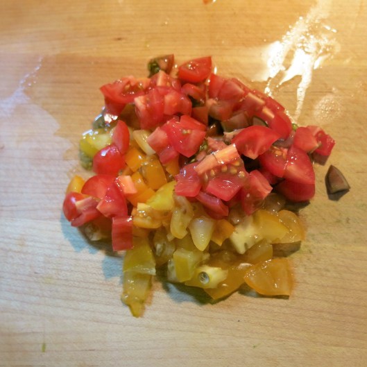 Diced red and yellow cherry tomatoes for Greek Salmon
