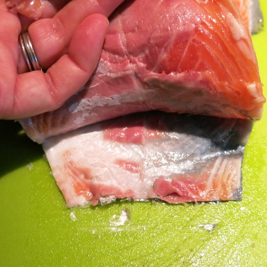 Evening out the tail-end of a salmon filet.
