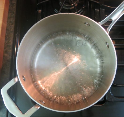 About 1 inch of water to heat the eggs and sugar for a Sponge Cake.