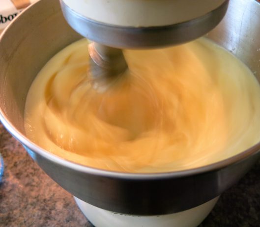 Beating warmed whole eggs and sugar together for Sponge Cake