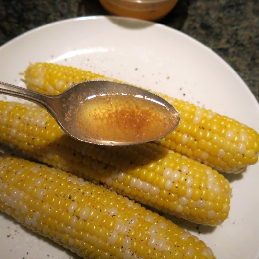 Drizzling Spiced Garlic Butter with Horseradish over Microwaved Sweet Corn