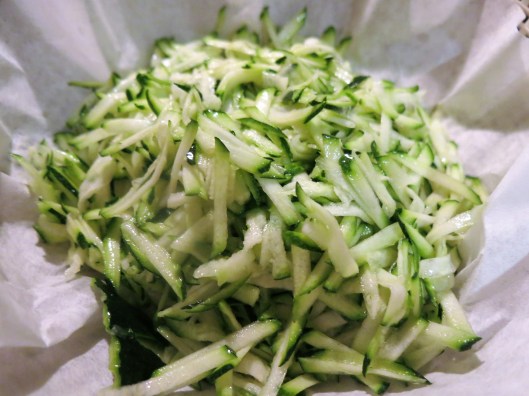 Draining Zucchini for Spicy Corn and Zucchini Cakes with Tomato Bits