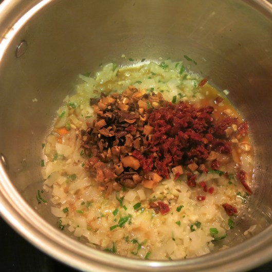 Mushrooms and Sun-Dried Tomatoes added to the Pot for Citrus-Laced, Cuban-Style Risotto with Shrimp, Sun-Dried Tomatoes and Mushrooms