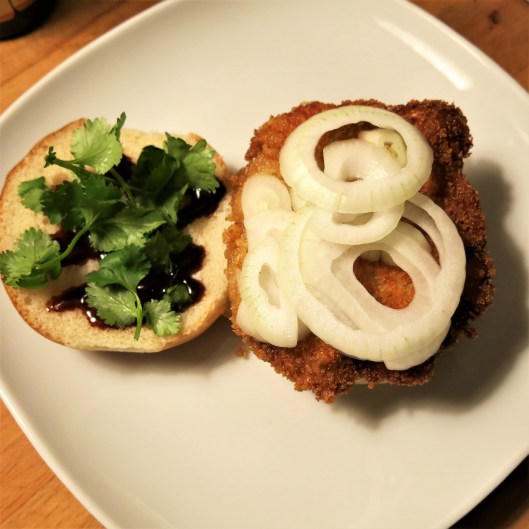 Breaded Pork Cutlet with Lemongrass-Garlic and Soy Marinade on a Bun with Toppings