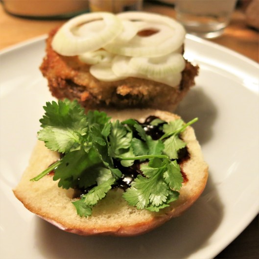 Breaded Pork Cutlet with Lemongrass-Garlic and Soy Marinade on a Bun with Toppings