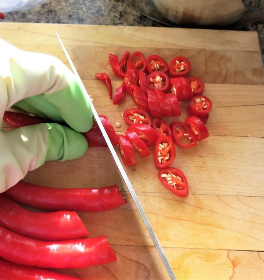 Cutting Peppers into Rings for Hot Pepper Rings in Olive Oil with Garlic