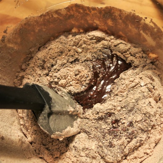 Combing the dry and wet ingredients for Bumpy Road Brownies