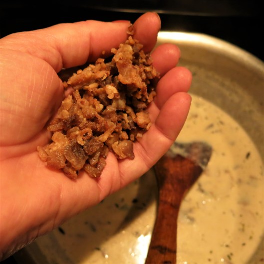 Adding Bacon Bits to the Mushroom-Leek Bisque with Thyme & Bacon Bits