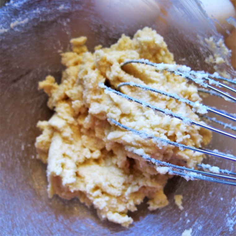 Mixing up Boozy Banana Bread with Chocolate and Toasted Nuts