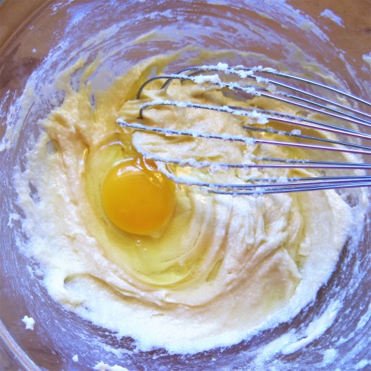 Mixing up Boozy Banana Bread with Chocolate and Toasted Nuts