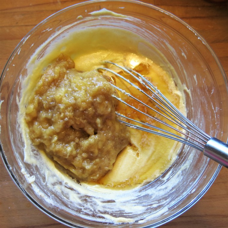 Mixing up Boozy Banana Bread with Chocolate and Toasted Nuts