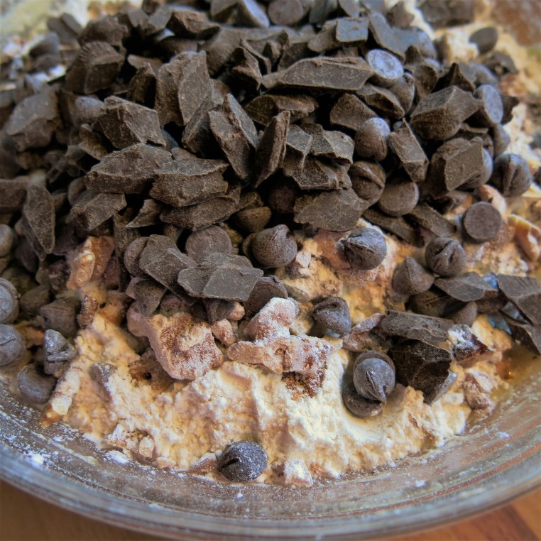 Mixing up Boozy Banana Bread with Chocolate and Toasted Nuts