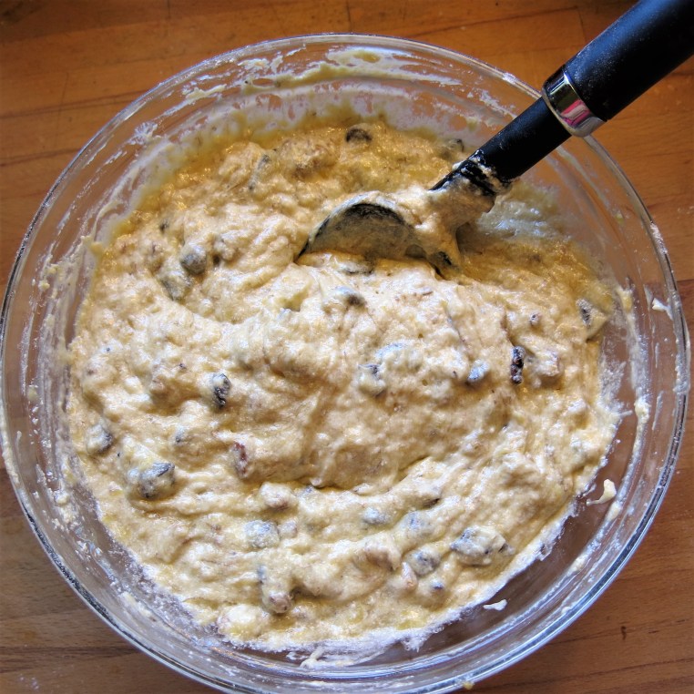 Mixing up Boozy Banana Bread with Chocolate and Toasted Nuts