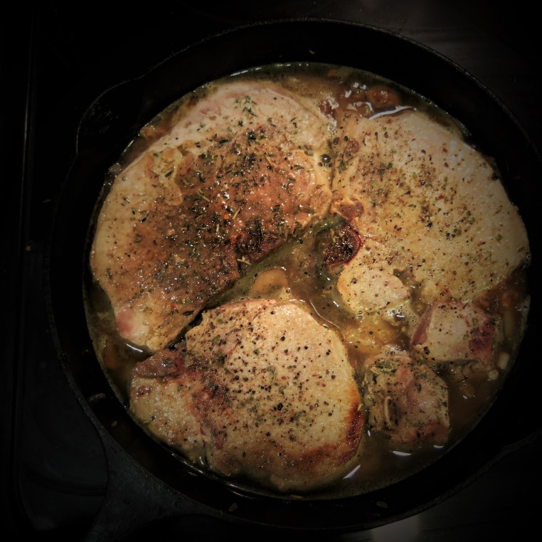 Skillet Pork Chops on a Bed of Onions and Mushrooms